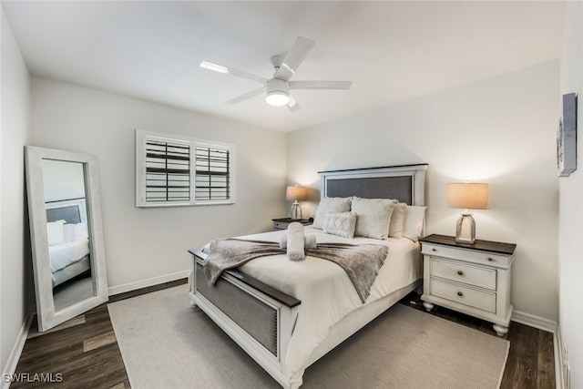 bedroom with ceiling fan and dark wood-type flooring