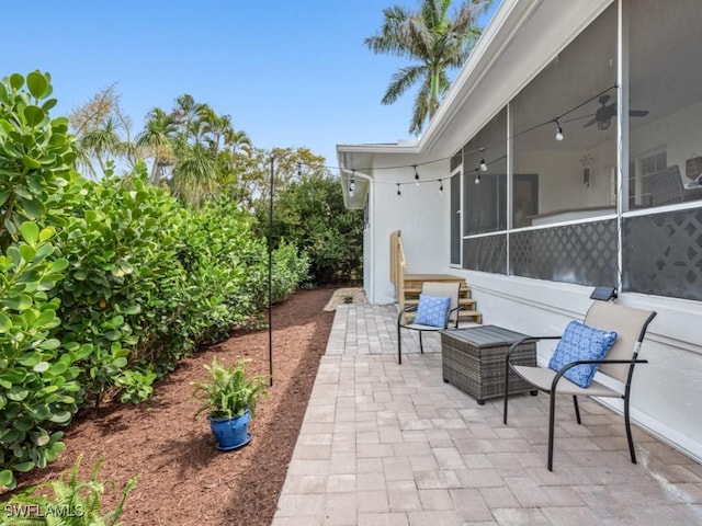 view of patio featuring ceiling fan