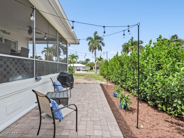 view of patio featuring ceiling fan