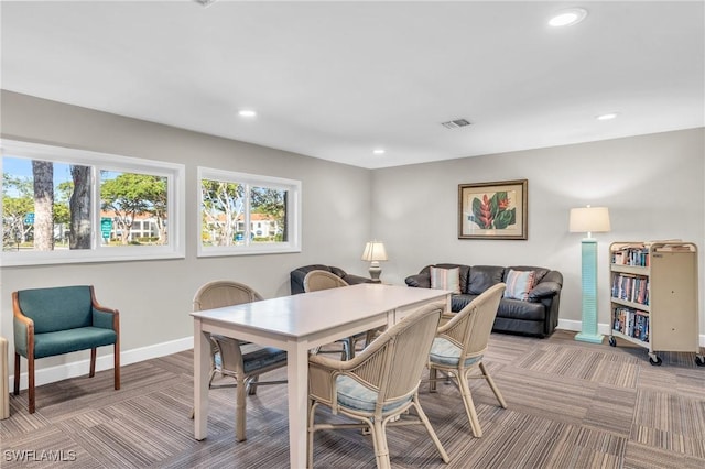 view of carpeted dining area