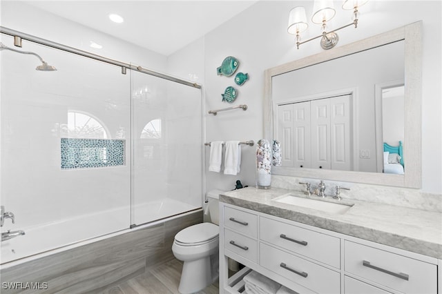160 Barefoot Cir Unit 38, Bonita Springs, FL 34134 - full bath with vanity, bath / shower combo with glass door, and toilet