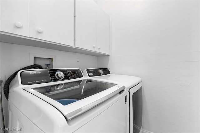 laundry area featuring cabinets and independent washer and dryer