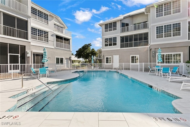 160 Barefoot Cir Unit 38, Bonita Springs, FL 34134 - community pool featuring fence and a patio area