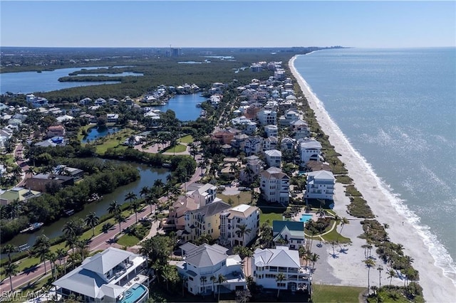 drone / aerial view with a water view and a view of the beach