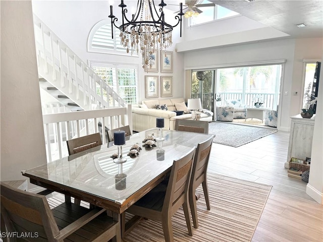 160 Barefoot Cir Unit 38, Bonita Springs, FL 34134 - dining area with a healthy amount of sunlight and light wood-style floors
