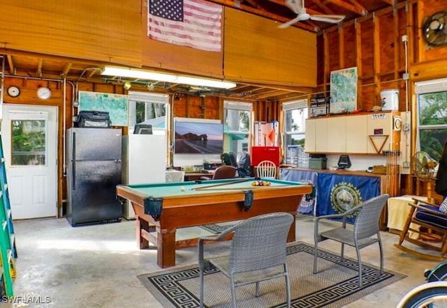 playroom featuring wood walls, ceiling fan, and billiards