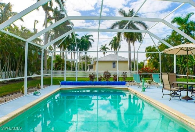 view of pool featuring a lanai and a patio