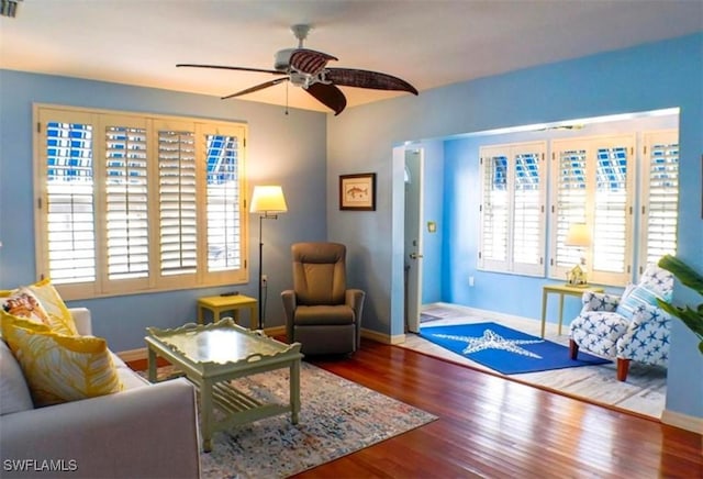 sitting room featuring ceiling fan and hardwood / wood-style flooring