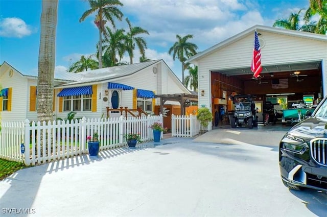 view of front of property with an outdoor structure and a garage