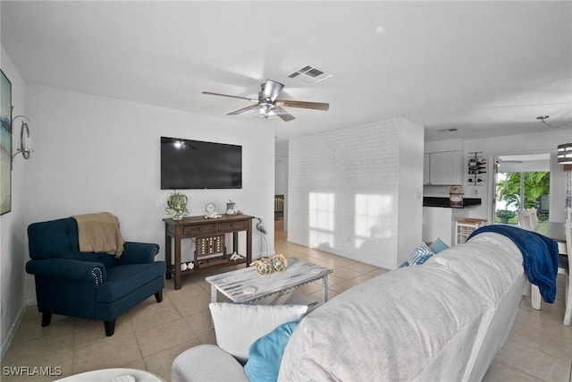 tiled living room featuring ceiling fan