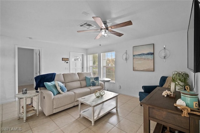 tiled living room with ceiling fan