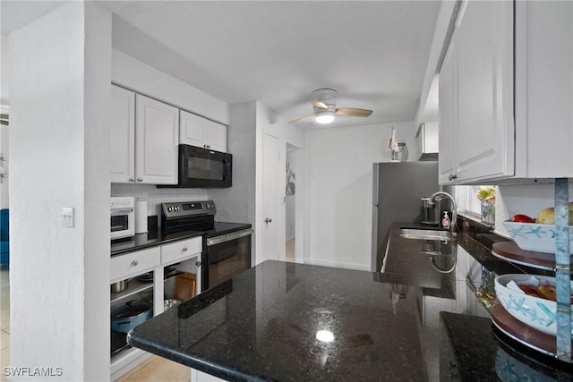 kitchen with kitchen peninsula, stainless steel appliances, ceiling fan, sink, and white cabinetry