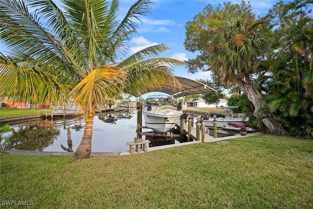 view of dock featuring a lawn and a water view