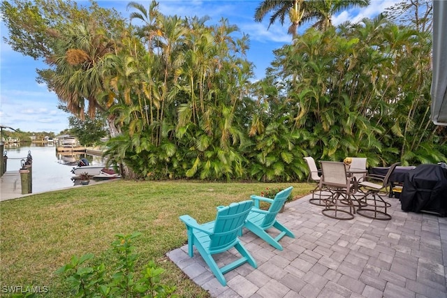 view of patio with a water view