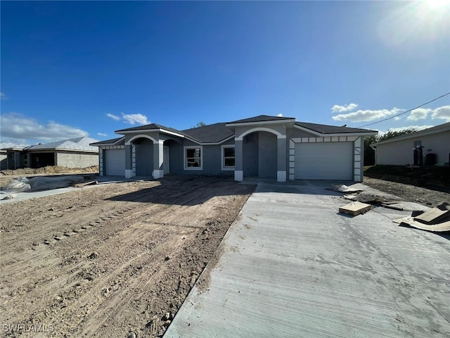 view of front of property with a garage