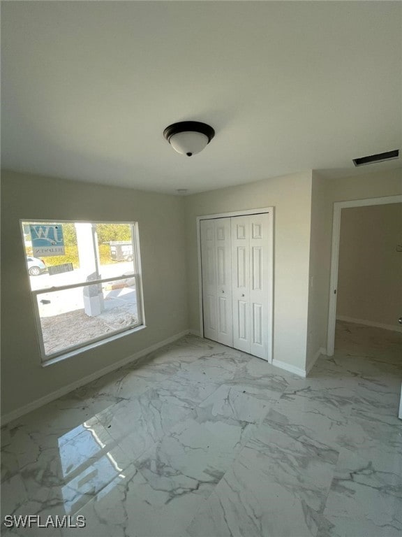 unfurnished bedroom featuring a closet