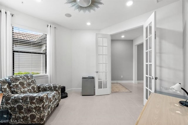 living area with french doors and a healthy amount of sunlight