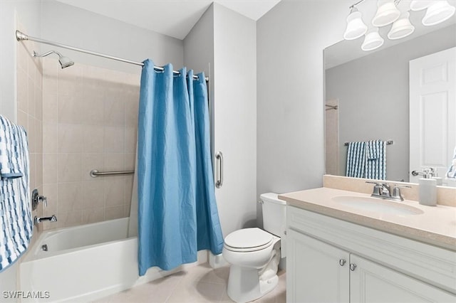 full bathroom with tile patterned flooring, vanity, shower / bath combo, and toilet