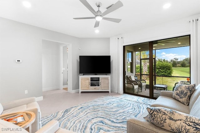 living room featuring ceiling fan and light tile patterned floors