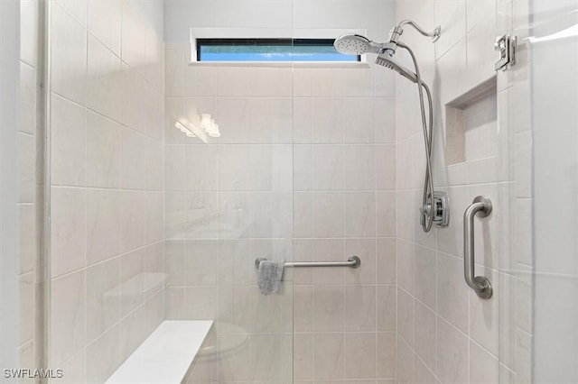 bathroom with tiled shower