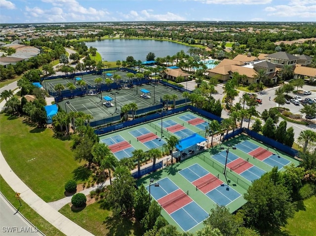 birds eye view of property with a water view