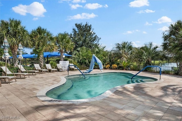 view of swimming pool featuring a patio area