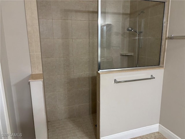 bathroom with tiled shower