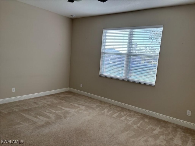 empty room featuring light colored carpet