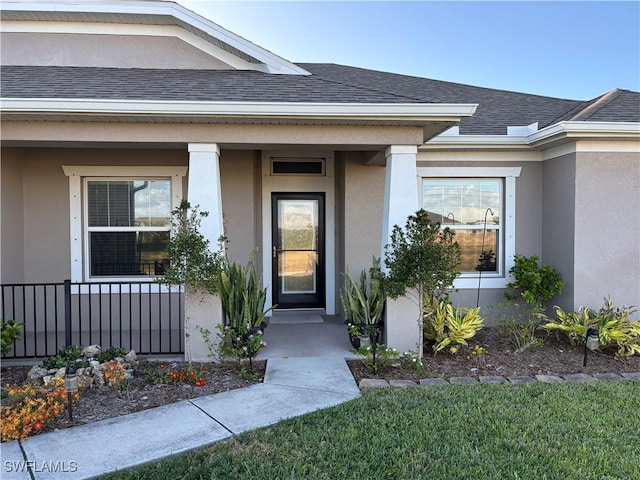 entrance to property featuring covered porch