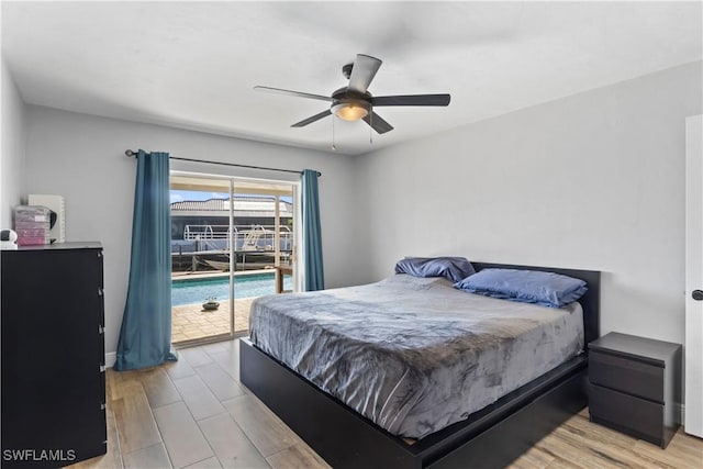 bedroom featuring access to exterior, light wood-type flooring, and ceiling fan