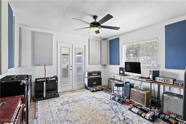 office area with french doors, light hardwood / wood-style floors, and ceiling fan