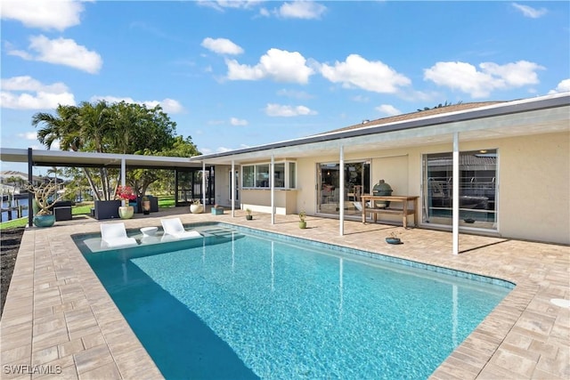 view of pool with a patio area and an outdoor hangout area