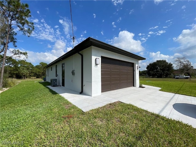 view of home's exterior featuring a garage and a lawn