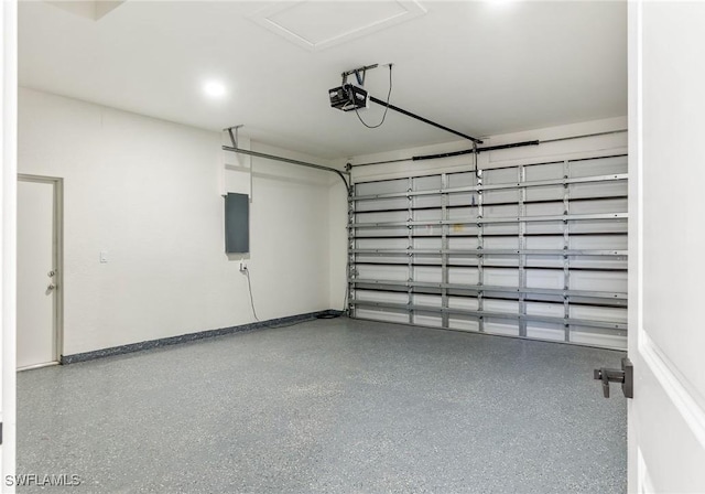 garage featuring electric panel and a garage door opener