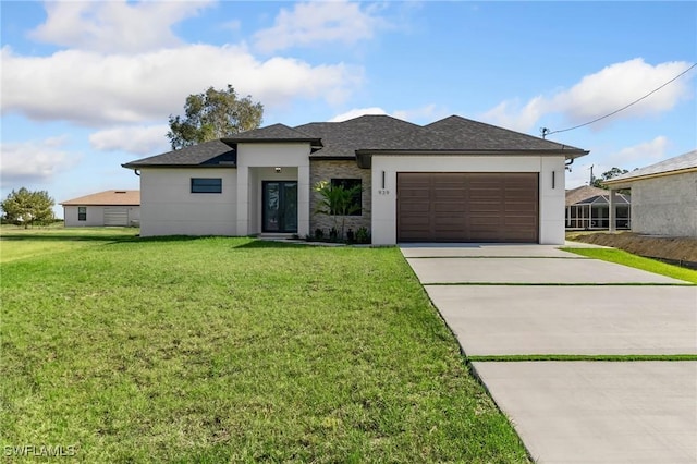 view of front facade featuring a front yard and a garage