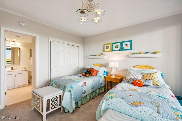 carpeted bedroom featuring crown molding, a closet, and sink