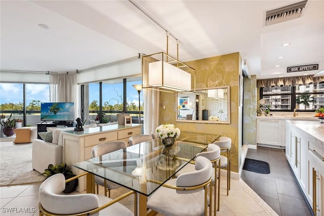 6001 Pelican Bay Blvd Unit 204, Naples, FL 34108 - dining room with tile patterned flooring and recessed lighting