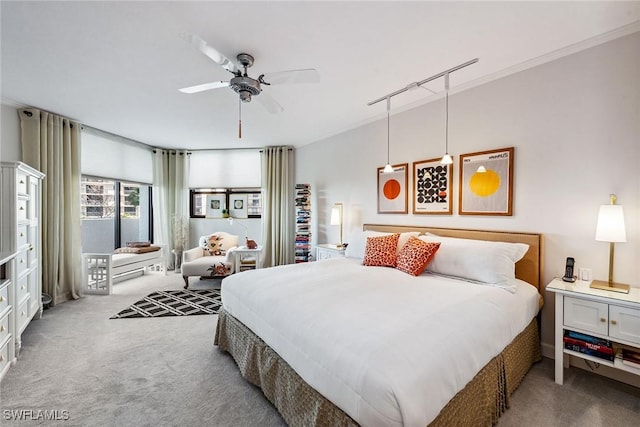 bedroom featuring carpet flooring, ceiling fan, and ornamental molding