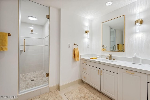 bathroom featuring vanity and an enclosed shower