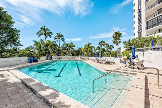 view of swimming pool with a patio