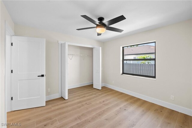 unfurnished bedroom featuring ceiling fan and light hardwood / wood-style flooring