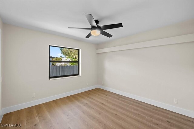 unfurnished room with ceiling fan and light hardwood / wood-style flooring