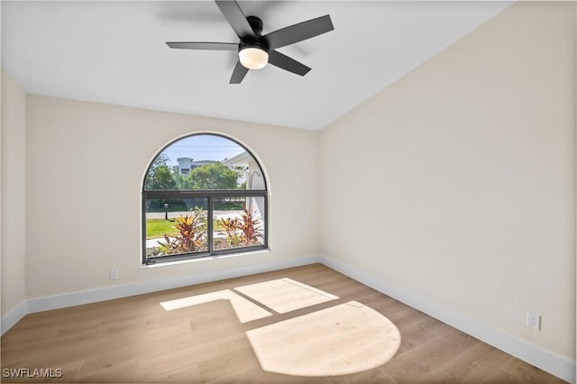 spare room featuring ceiling fan and light hardwood / wood-style flooring