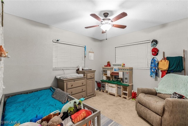 carpeted bedroom with ceiling fan