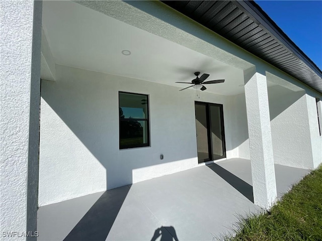 view of patio featuring ceiling fan