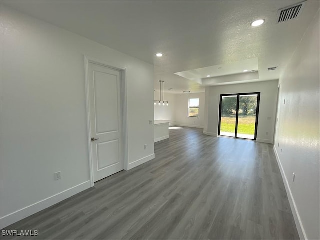 unfurnished living room featuring hardwood / wood-style floors