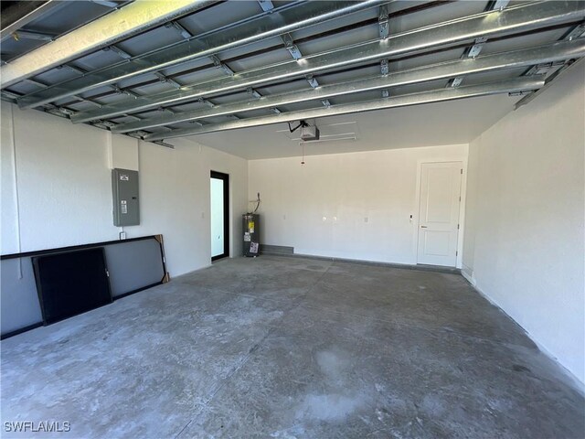 garage featuring electric panel, electric water heater, and a garage door opener