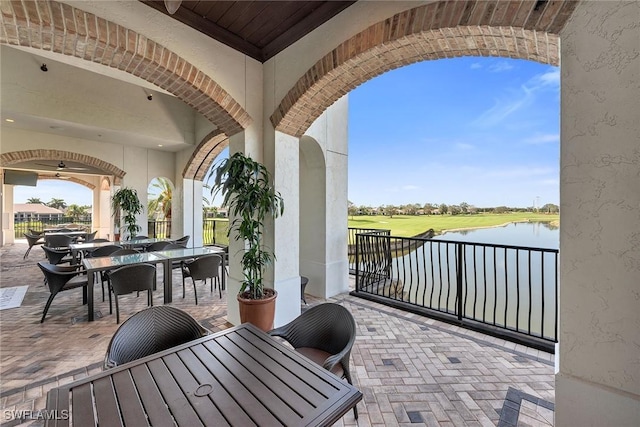 view of patio with a water view