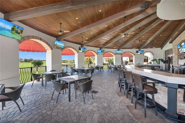 view of patio featuring an outdoor bar