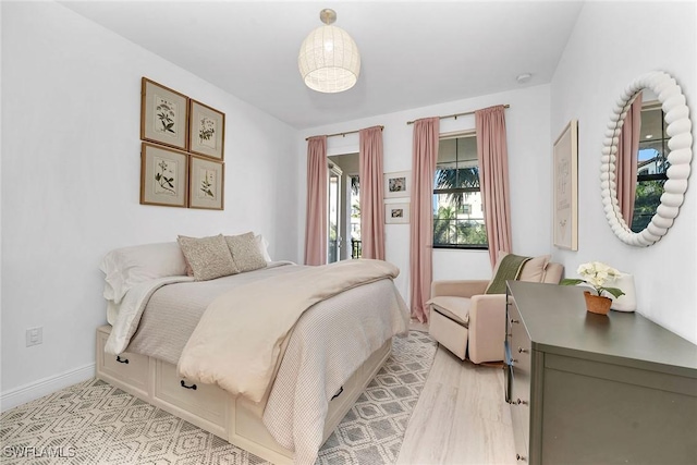 bedroom with light hardwood / wood-style flooring